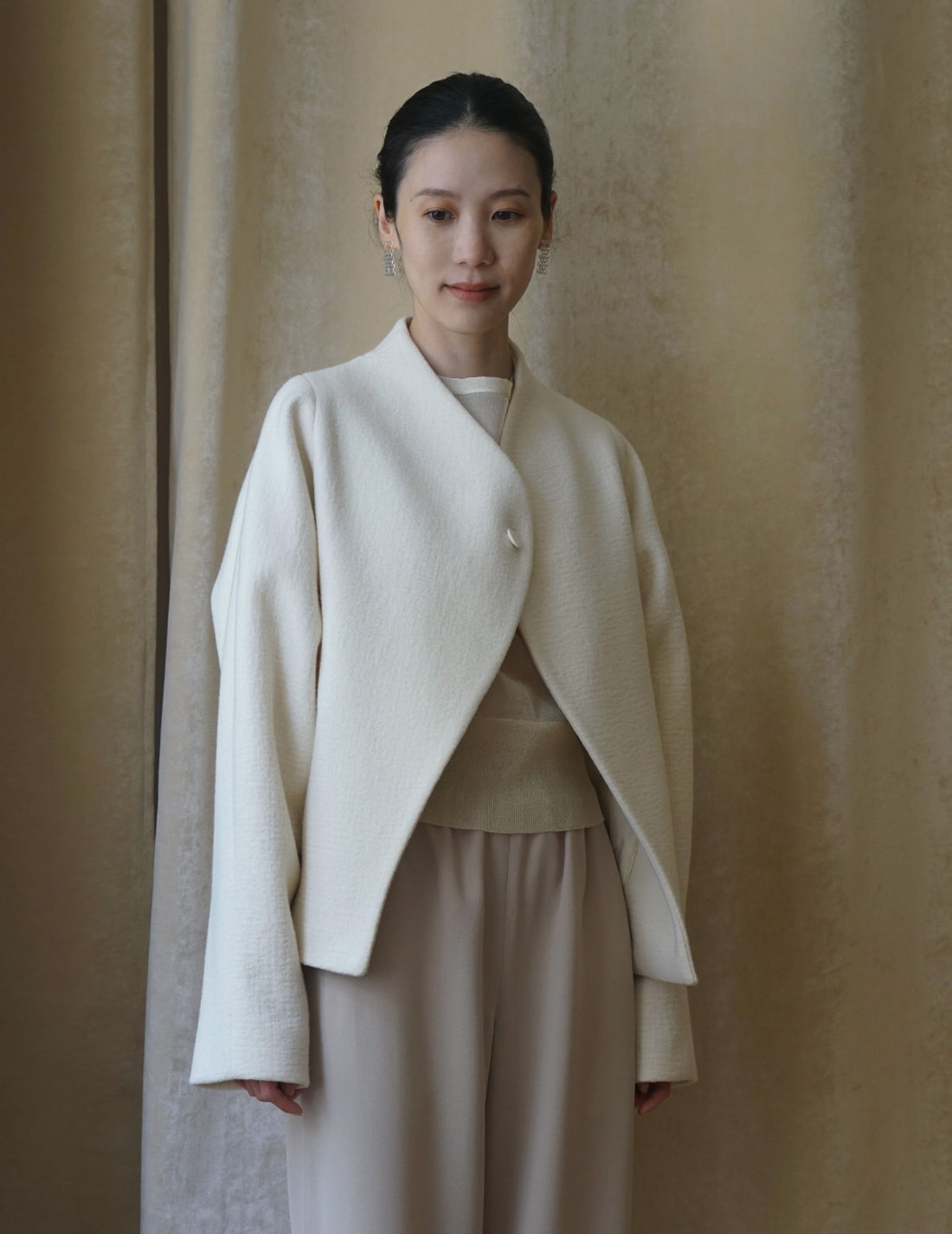 Veste à un bouton avec ligne oblique