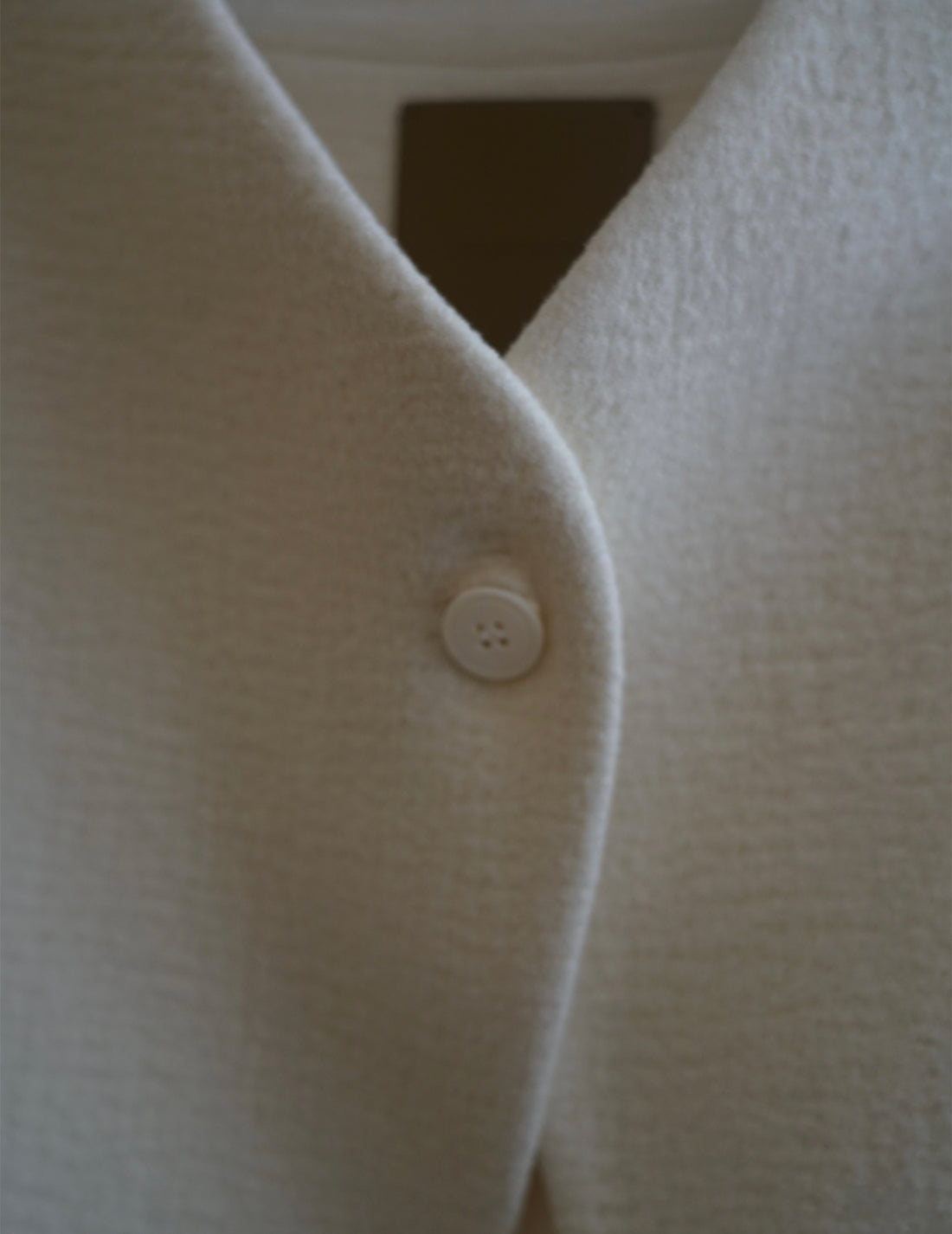Veste à un bouton avec ligne oblique